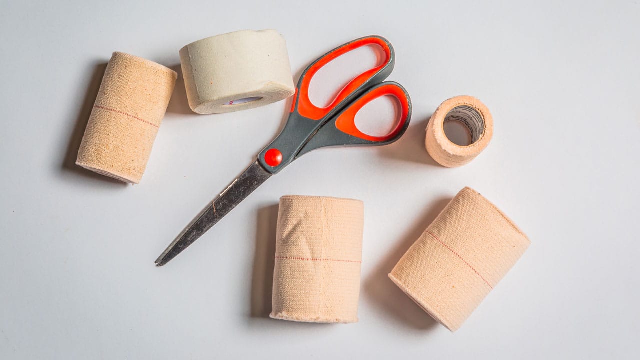 scissors, bandages and medical tape 